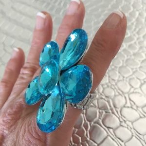 BLUE FLOWERED FUN STRETCH COSTUME RING ONE SIZE FITS ALL JUST A SPLASH OF COLOR.